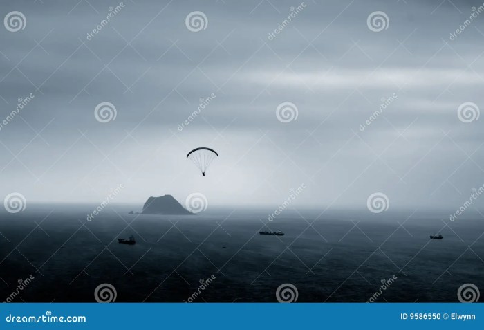 Parachuting tourists parasailing